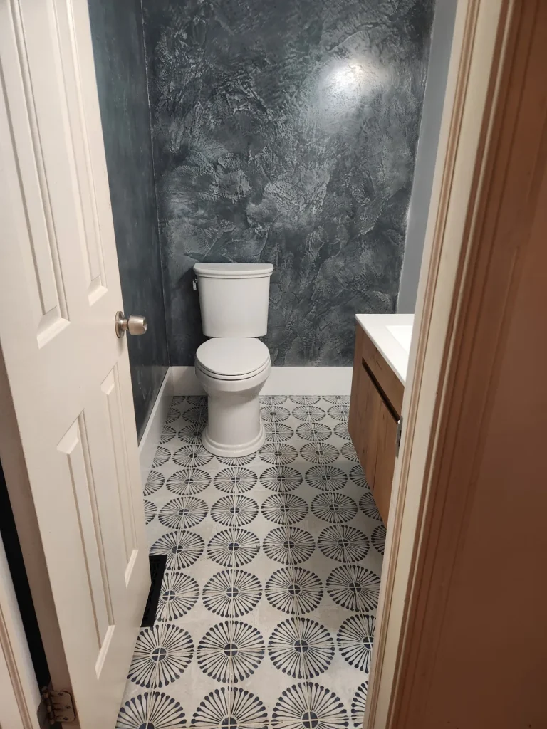 Charcoal decorative bathroom wall finish with patterned floor tile